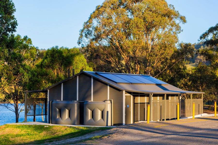 How does the amenity building resist corrosion?